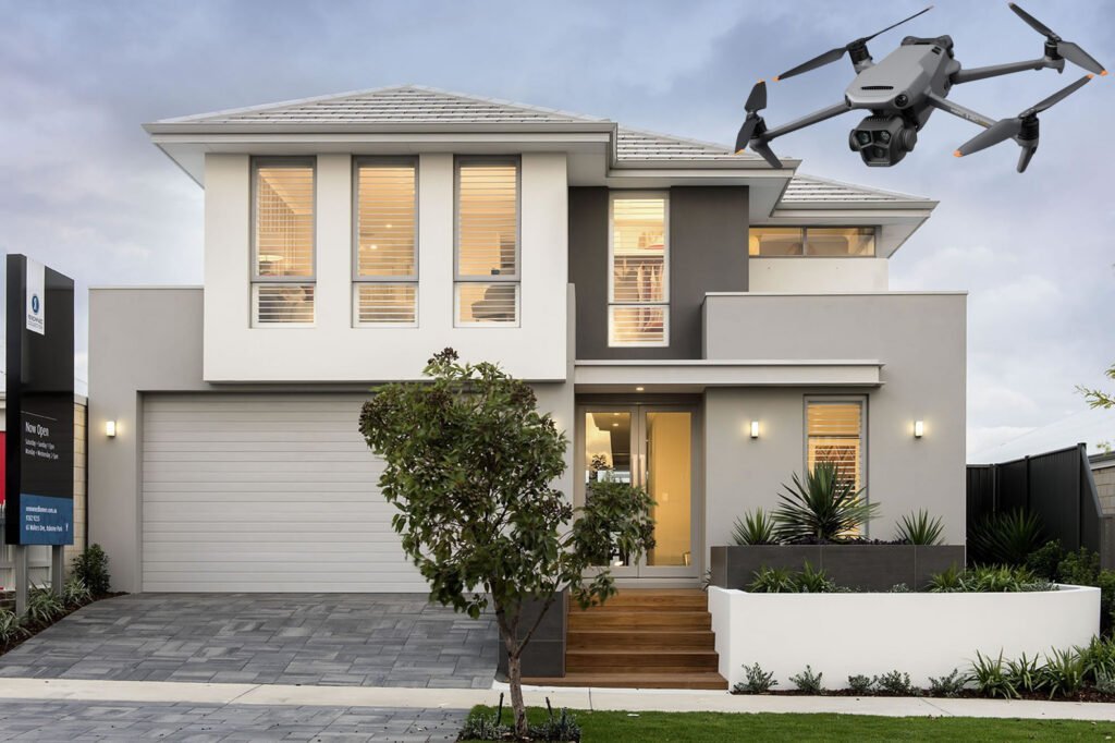 alt="Aerial drone with camera, flying over a residential house"
